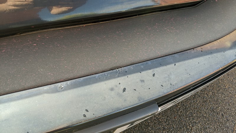 Faded damaged paint on the Fiat X1/9 bumper