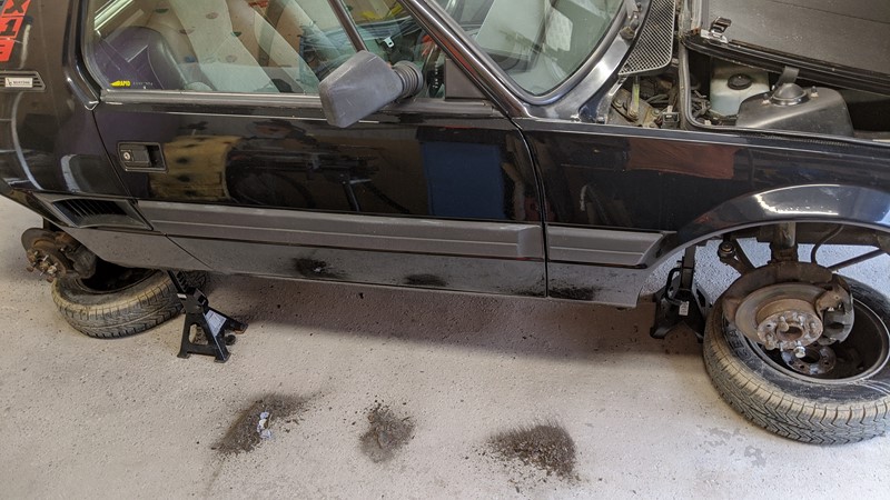 rust piles around the FiatX1/9