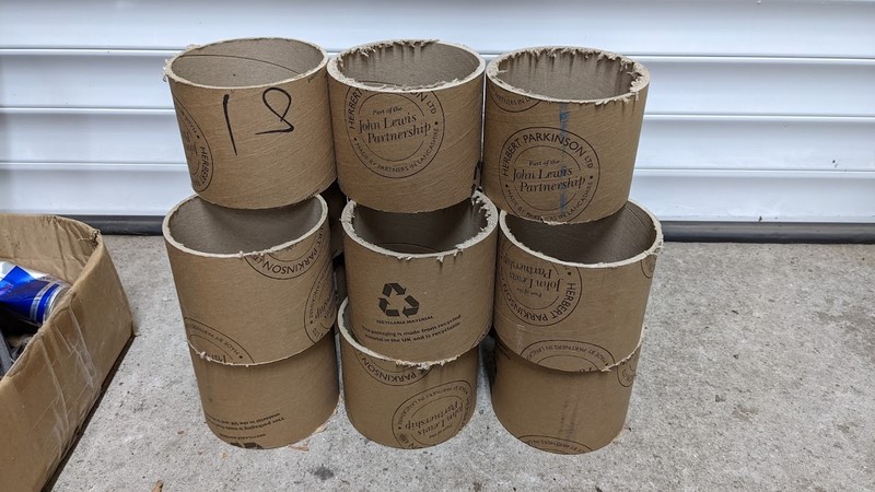 A long cardboard tube is turned into a form for the concrete piers.