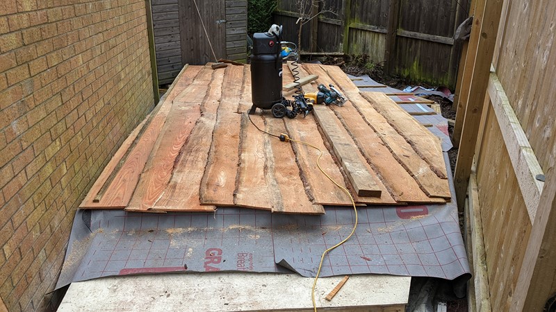 A long 2x6" timber helps to get the cladding lined up.