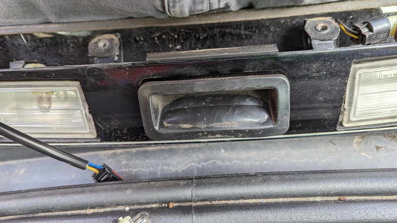 Extract the harness through the boot switch hole.