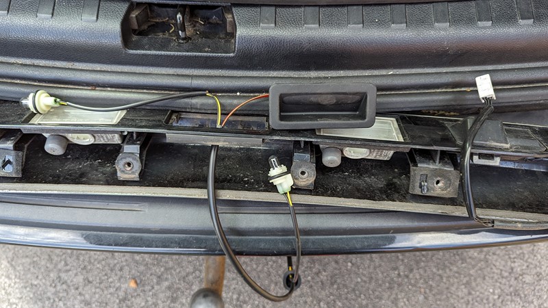The new genuine boot switch gets installed.