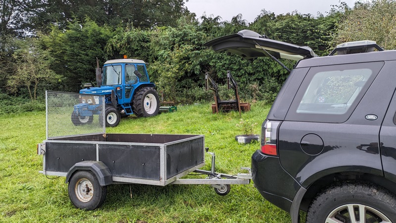 Trima loader sat in the field awaiting new pipes.