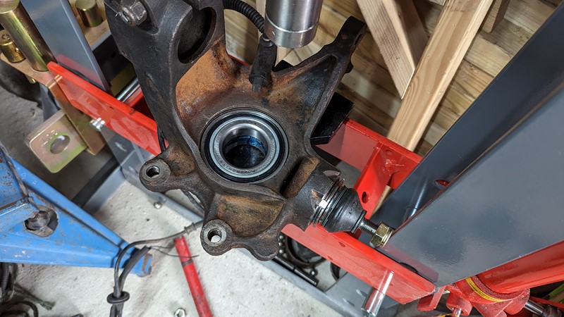 New bearing is pressed back into the swivel housing.
