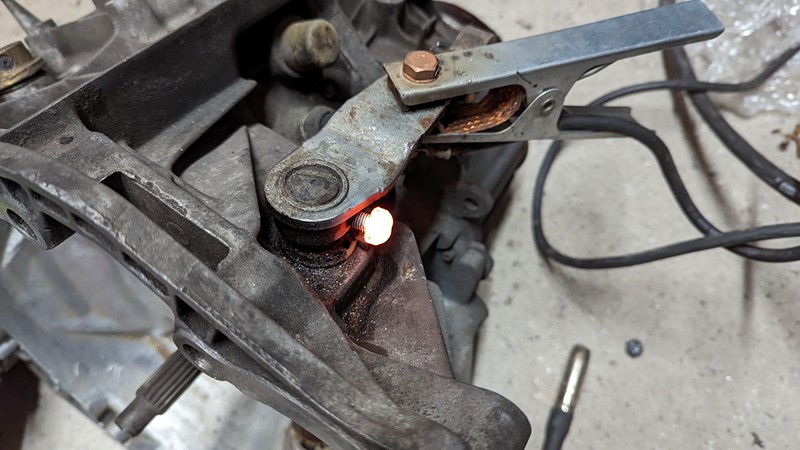 Liberaly application of heat does not release the pin from the gearbox.